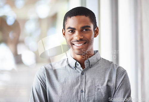 Image of Happy black man, portrait and window with confidence or ambition for career, job or creative startup at office. Face of African male person or employee with smile for expertise or positive attitude