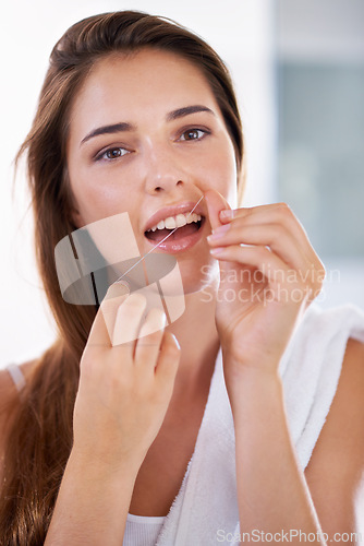 Image of Health, dental and portrait of woman with floss for grooming, wellness and clean routine for hygiene. Oral care, happy and female person with dentistry tool for teeth or mouth treatment in bathroom.