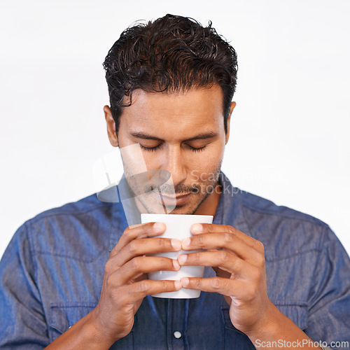 Image of Calm, man and drink of coffee in morning with peace, happiness and breathe in aroma of espresso. Happy, person and relax with latte, matcha or tea in white background of studio with mock up space