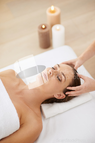 Image of Relax, head massage and woman at spa for health, wellness and zen with luxury holistic treatment. Self care, peace and girl on bed for aromatherapy, comfort and calm pamper service at hotel salon