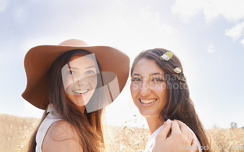 Image of Portrait, sunshine and field with women, friends and smile with vacation or countryside with adventure. Face, girls or people with weekend break or nature with fresh air, journey or windy with summer