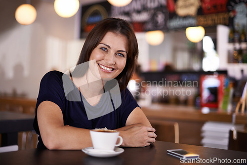 Image of Portrait, smile and woman for relax in cafe with coffee, cappuccino or latte drink on lunch break. Caffeine, mobile phone and face of person for hot beverage for calm, peace and weekend off at bistro