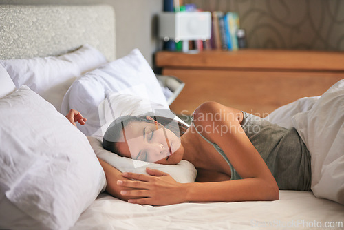 Image of Woman, peaceful and sleeping in bed, home and weekend rest for energy. Morning, dreaming and relax in apartment for tired and exhausted female person, comfort for fatigue with nap for mental health