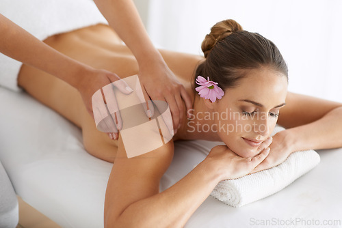 Image of Relax, massage and woman at hotel spa for health, wellness and zen balance with luxury holistic treatment. Self care, peace and girl on table for muscle therapy, comfort and calm body pamper service