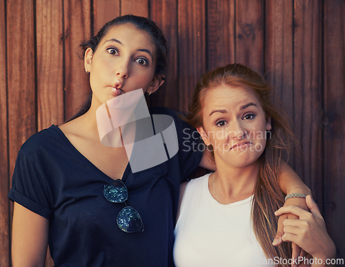 Image of Portrait, funny face and woman friends on wooden background together for bonding or relationship. Love, comedy or humor and happy young people having fun summer for holiday, vacation and getaway