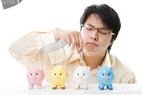 Image of Asian businessman saving money