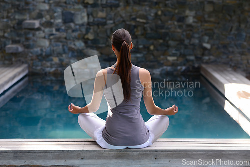 Image of Back, pool and meditation with woman, yoga and fitness with sunshine and peace with breathing. Rear view, person and water with girl and yogi with wellness and healthy with hobby, relax and exercise