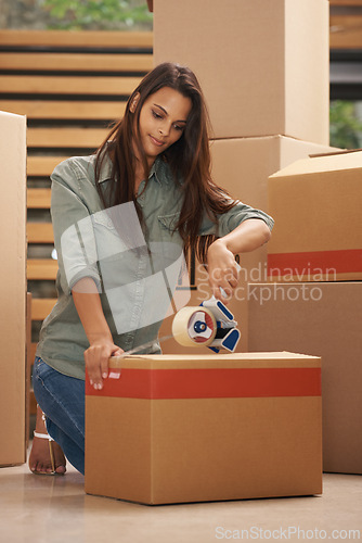 Image of Woman, house and moving with box for packing with sealing tape in new home, ownership and property. Female person, smile and cardboard for furniture or clothes with items for apartment as investment