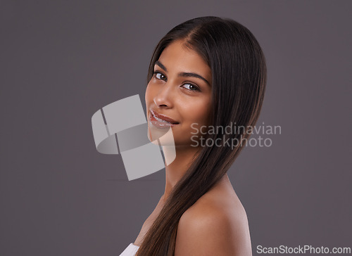 Image of Salon, hair and portrait of woman on gray background for healthy texture, wellness and beauty. Haircare, hairdresser and face of person with long hairstyle for treatment, cosmetics or shine in studio