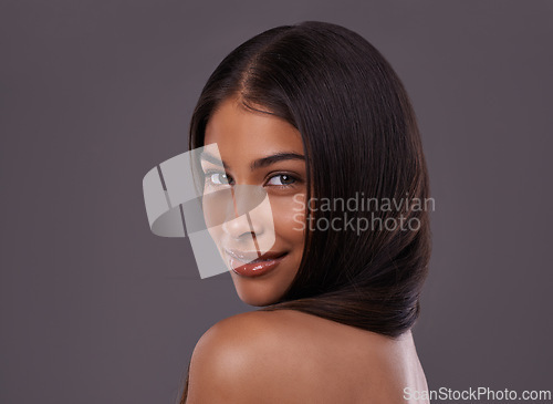 Image of Hair care, beauty and portrait of woman in on gray background for healthy texture, wellness and shine. Salon, hairdresser and person with long hairstyle for products, cosmetics and keratin in studio