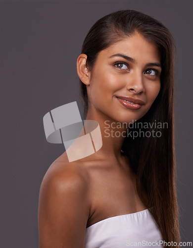 Image of Thinking, hair and woman on gray background for wellness, healthy texture and beauty. Haircare, hairdresser and face of person with long hairstyle for keratin treatment, cosmetics and shine in studio