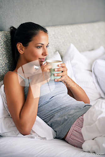 Image of Woman, drinking coffee and bed thinking for relax in morning on weekend or home break, day off or leisure. Female person, beverage and linen in apartment with thoughts for Sunday, resting or calm