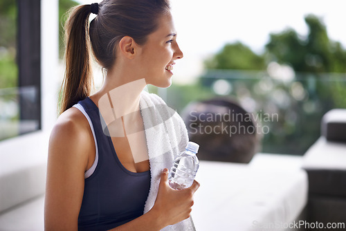Image of Exercise, bottle and happy woman with water to drink, health and hydration for gym, training and workout. Activewear, trainer or athlete relaxed for fitness, wellness and cardio for vitality