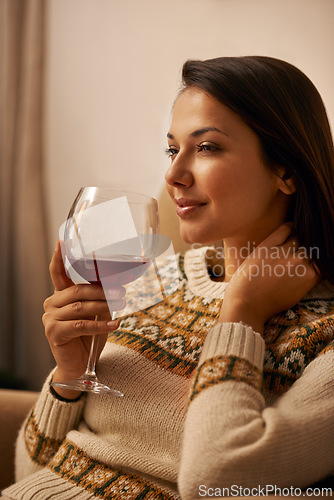 Image of Woman, thinking and relax in home with wine for daydreaming, wellness and weekend break with happiness. Person, face and thoughtful in living room with alcohol for antioxidant or celebration in house