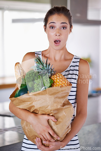 Image of Home, surprise or portrait of woman with groceries on promotion, sale or discounts deal on nutrition. Wow, news offer or shocked person buying healthy food for cooking organic fruits or diet choice