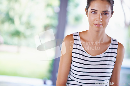 Image of Home, confidence portrait of woman on mockup for leisure, chill and relax by window in house. Female person, break and serious face with comfort, enjoyment and wellness for me time in apartment