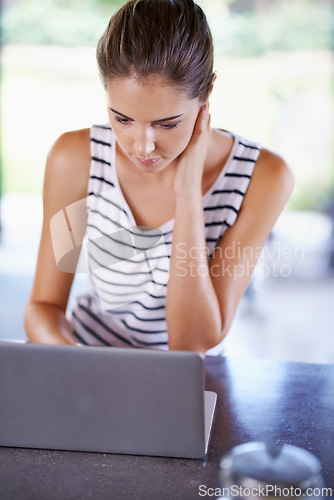 Image of Reading, blog and woman in home with laptop for research and recipe for dinner. Online, thinking and person scroll on computer and learning from internet about information and streaming in kitchen