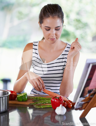 Image of Cooking, vegetables and woman in kitchen for lunch, dinner and supper for healthy eating. Nutrition, recipe and person with food, ingredients and cutting board for wellness, diet and meal in home