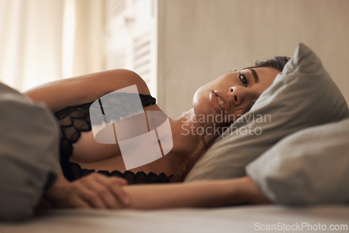 Image of Relax, portrait and woman in bed at her home on weekend morning for calm, rest or sleeping. Confident, beautiful and young female person laying with duvet blanket in bedroom at apartment in Canada.