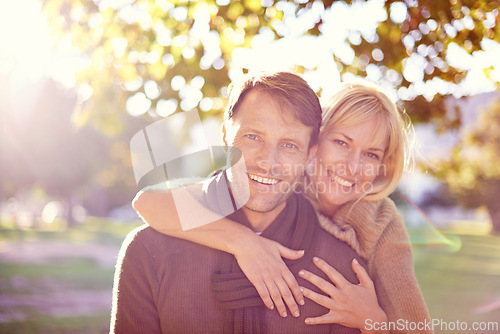 Image of Hug, portrait and couple in a park with love, support and romance at sunset outdoor. Travel, face and people embrace in nature with security, fun or bonding on adventure, journey or holiday trip