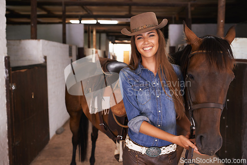 Image of Woman or cowgirl, portrait and horse in barn to train or feed and grooming for animal or pet care. Person, stallion and stable to ride together in countryside in Texas for rural life and adventure.