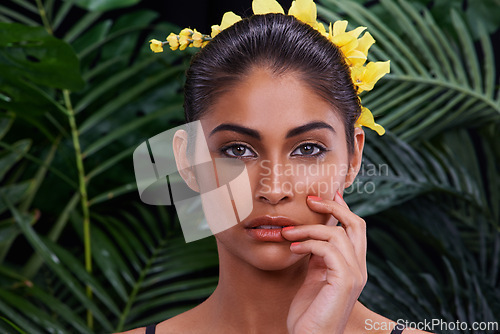 Image of Crown, portrait or woman with flowers for beauty, makeup or wellness in nature, rainforest or jungle. Tropical, Indian person or face of model with eco friendly skincare, plants or spring floral art