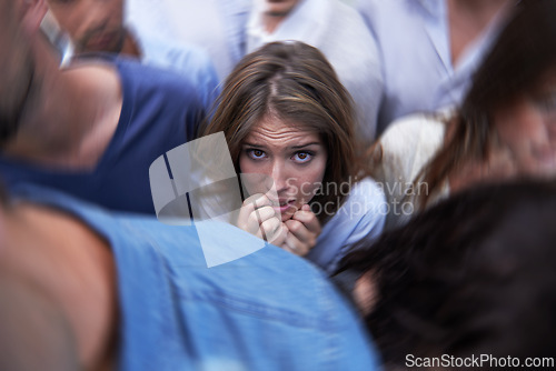 Image of Woman, crowd and trapped with social anxiety at work with stress, scared and overthinking with concern. Female person, coworkers and people with worry, nervous and stuck at office as introvert