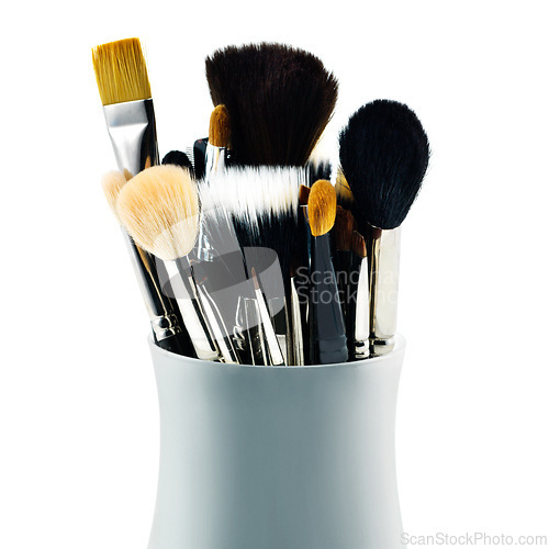 Image of Cosmetics, makeup and beauty with brush, tool and aesthetic for skincare on white background. Studio, choice and quality for blending, soft and product for transformation, creative and application