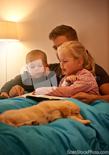 Image of Books, night or father with kids in bed for reading, learning and bonding with dog at home Love, family and dad with children in bedroom for storytelling, fantasy or literature for teaching pet care