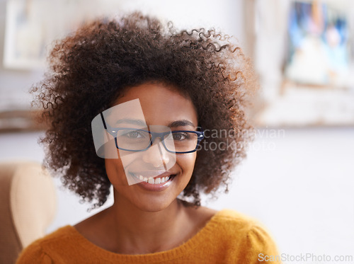 Image of Portrait, smile and relax woman in home lounge, happy and eyewear for natural lady. Head, confidence and glasses with curly hair for female person from London, positive in living room or apartment