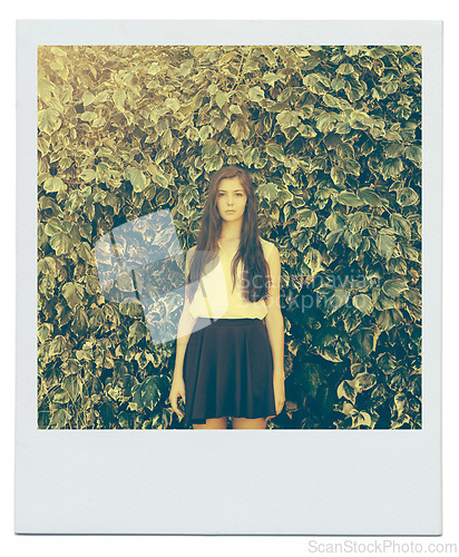 Image of Bush, leaves and portrait of girl in nature for peace, zen and relax outdoors on polaroid. Female person, teenager and fashion in garden for trendy, style and summer vacation with serious face