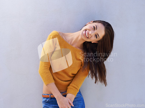 Image of Portrait, fashion and happy woman on a wall, model or funny girl laughing isolated on a purple background mockup space. Smile, trendy and person in casual clothes, jeans or stylish sweater in Italy