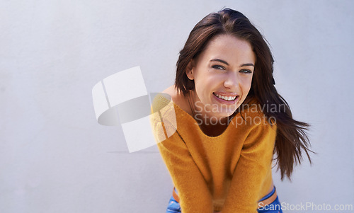 Image of Portrait, fashion and smile of woman on a wall, model or girl isolated on a purple background mockup space. Face, beauty and happy person in casual clothes for trendy style in cool sweater in Italy