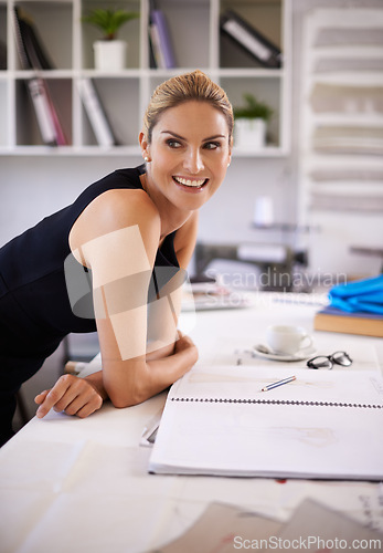 Image of Fashion designer, thinking and happy woman with sketch, drawing or creative ideas for clothes production at workshop desk. Young worker or artist with business, planning and inspiration for startup