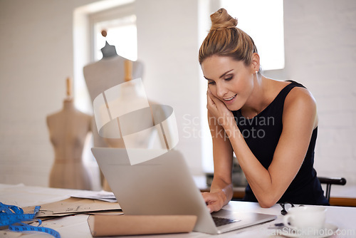 Image of Designer, woman and phone call in workshop for fashion with laptop, happy and communication for deal. Person, smartphone and computer with conversation, negotiation or contact for material in studio