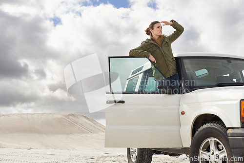 Image of Car, road trip and woman in a desert for location, search or holiday, adventure and exploration. Travel, stop and female person with vehicle in Egypt for sand dunes journey, nature or waiting outdoor