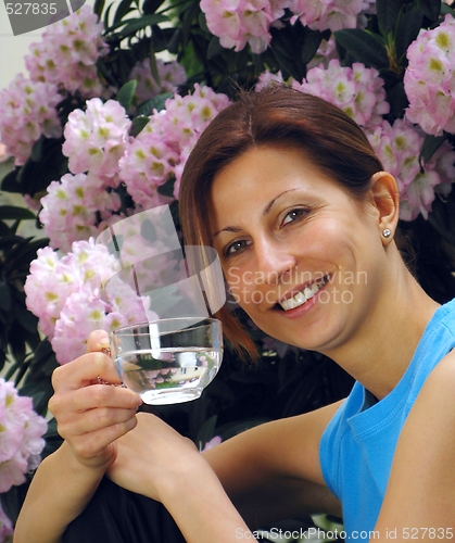 Image of Young girl drinking water