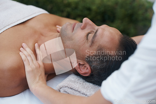 Image of Spa, man and hands with massage for relax at resort, luxury hotel and vacation for relax and therapeutic pamper. People, masseuse and body care with shoulder treatment, hospitality and zen outdoor