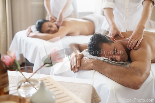 Image of Spa, back massage to relax and couple with masseuse for luxury pamper treatment together. Beauty, wellness or therapy with mature husband and wife at resort or salon for natural stress relief