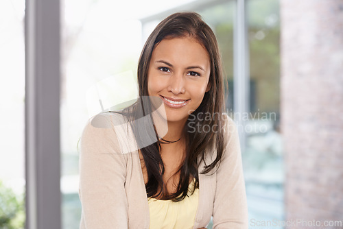 Image of Happy woman, portrait and relax with casual fashion, positive attitude or natural beauty at home. Face of young female person, brunette or model with smile for holiday, break or weekend at the house