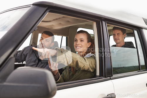 Image of Friends, car and pointing on road trip with travel for adventure, vacation and sightseeing with happiness in countryside. Woman, men and driving in vehicle for holiday journey, tourism and scenery