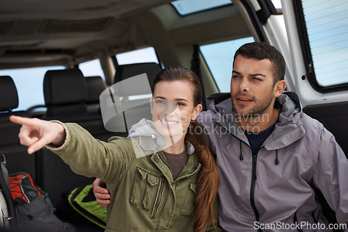 Image of Couple, car and pointing on roadtrip with travel for adventure, vacation or sightseeing with happiness in countryside. Woman, man or driving in vehicle for holiday journey, tourism and honeymoon trip