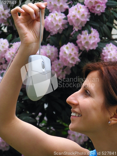 Image of Young girl holding computer mouse