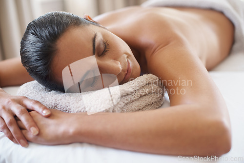Image of Relax, massage and woman at spa for peace, calm and skincare at luxury resort with eyes closed for wellness. Beauty, therapy or person at salon for body treatment, health or rest on table for service