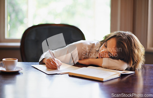 Image of Remote work, sleeping and tired woman with books, fatigue or snooze while writing in home office. Freelance, burnout or female writer with pen in a house exhausted by reading, research or novel notes