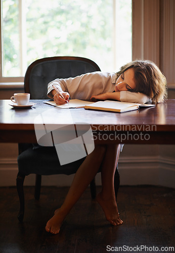 Image of Sleeping, remote work and tired woman with books, fatigue or snooze while writing in home office. Freelance, burnout or female writer with pen in a house exhausted by reading, research or novel notes