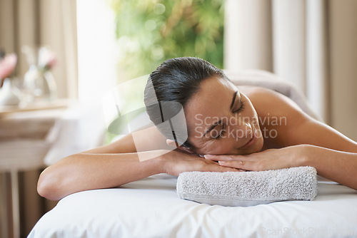 Image of Spa, treatment and happy woman on massage table, salon and beauty therapist in wellness centre. Peaceful, zen and physical therapy for body and relax, pamper and skin care for sleeping female client