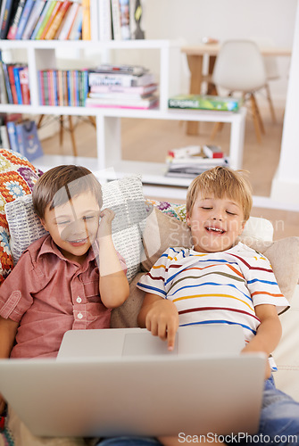 Image of Laptop, children and siblings on a sofa with cartoon, film or streaming movie at home. Computer, learning or boy kids in a house for google it, search or ebook storytelling, show or Netflix and chill