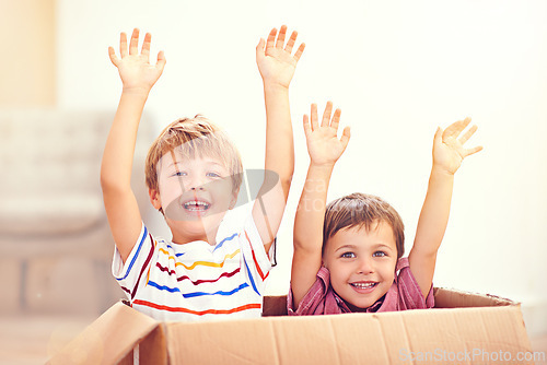 Image of Children, box or portrait of siblings playing in house for fun, bonding or hands up game. Cardboard, learning and excited kids in living room for celebration, imagine or rollercoaster fantasy at home