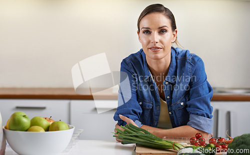 Image of Cooking, kitchen and portrait of woman with vegetables on wooden board for wellness, meal prep and nutrition. Healthy diet, home and person with ingredients for vegetarian dinner, lunch and supper